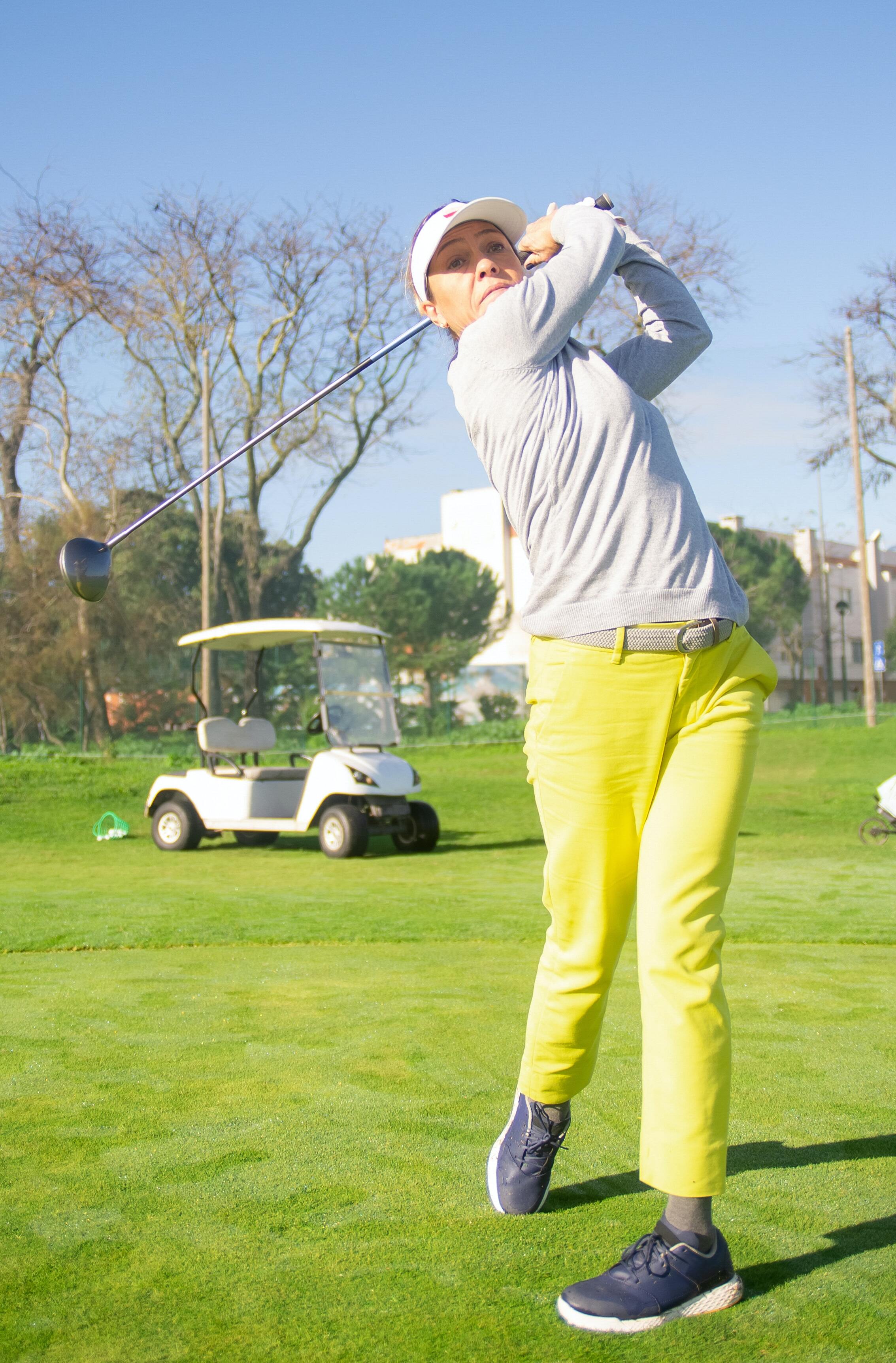 Image of woman playing golf